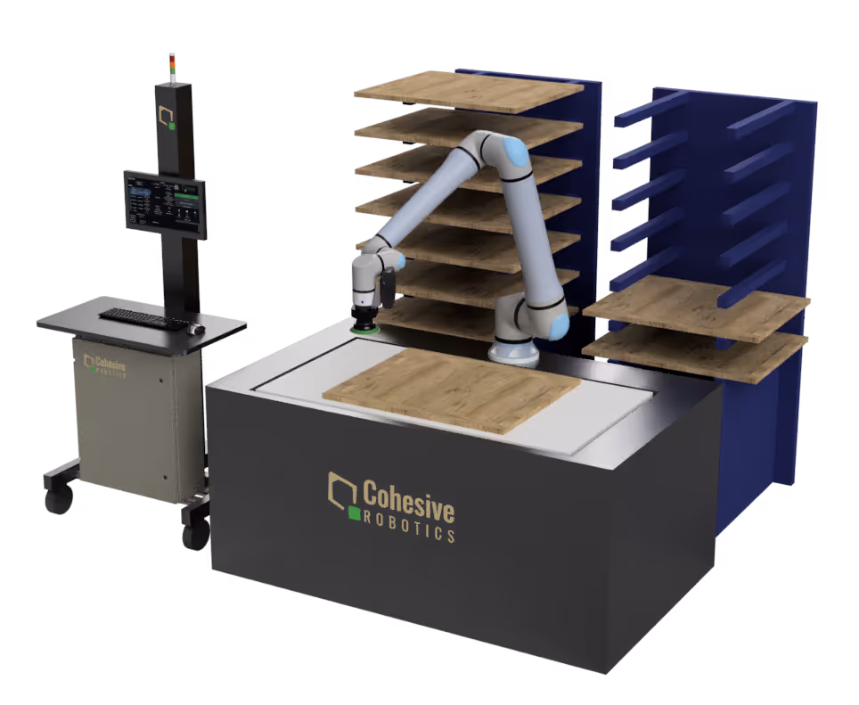Automated robotic arm system by Cohesive Robotics handling wooden panels, with storage racks and control station.