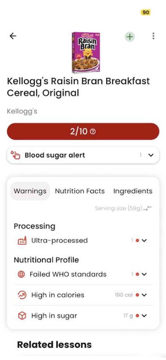 Pantalla del esc&aacute;ner de productos de GoCoCo: un cereal de desayuno con una puntuaci&oacute;n de 2/10, alerta de az&uacute;car en sangre y advertencias de procesamiento.