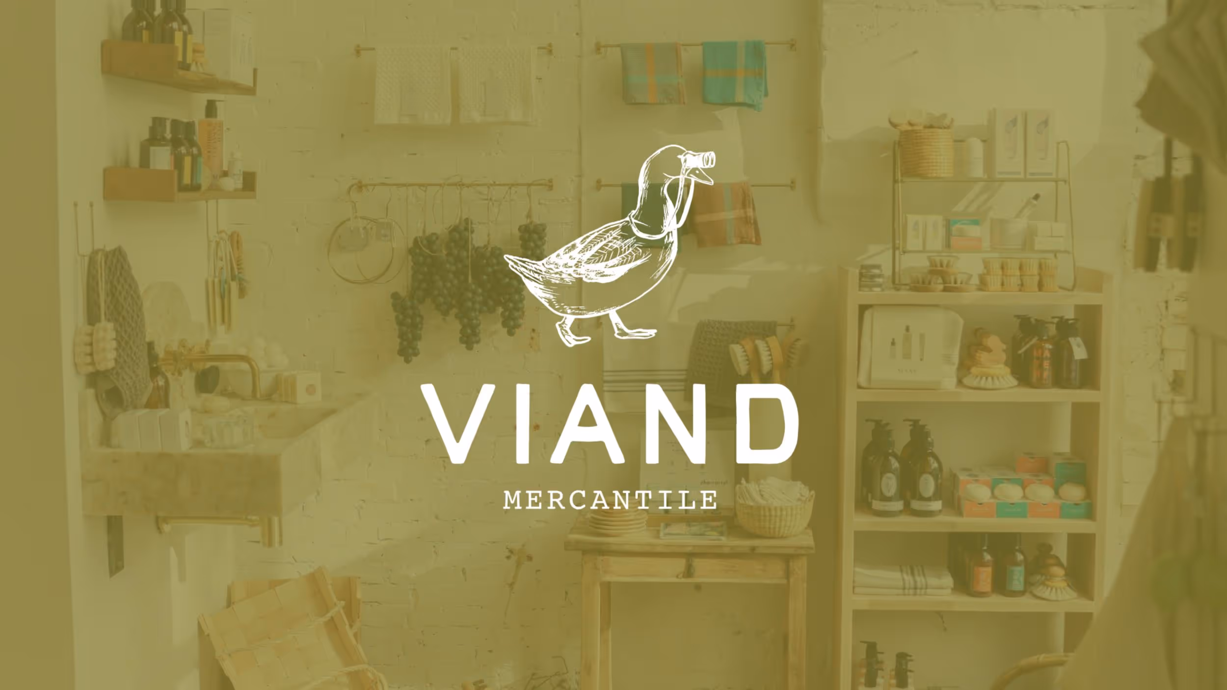 Viand Mercantile logo on vintage kitchen shelves with various goods