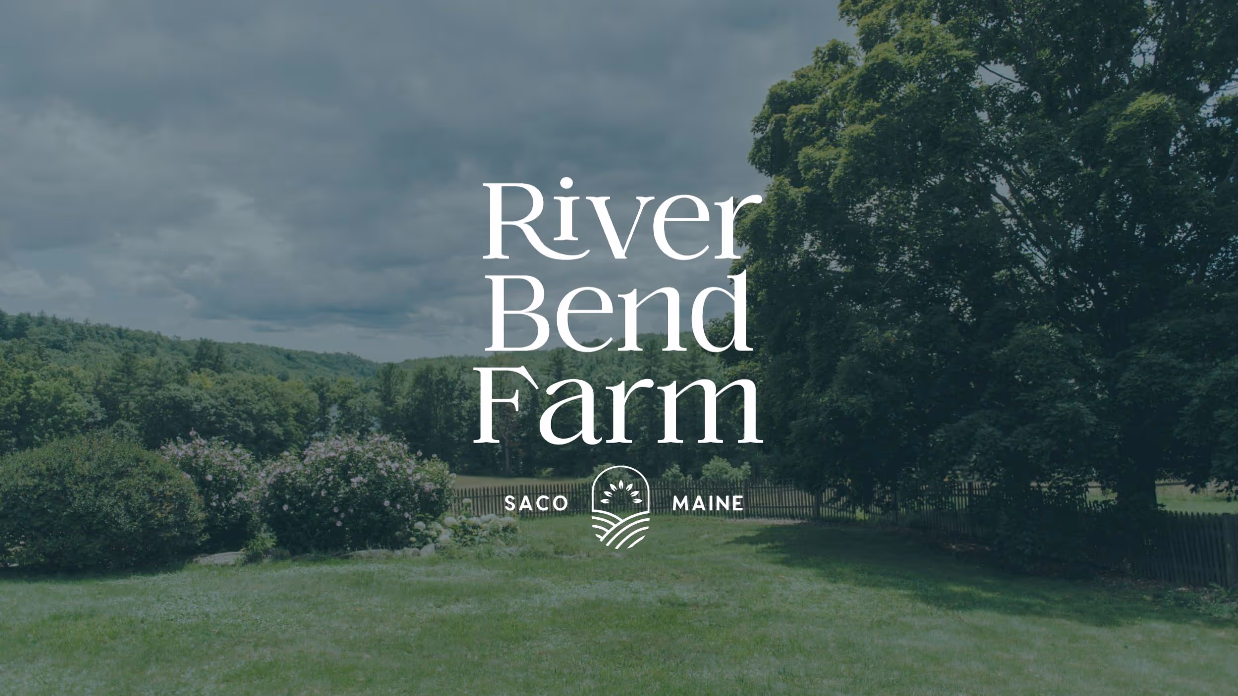 River Bend Farm logo over lush green landscape in Saco, Maine