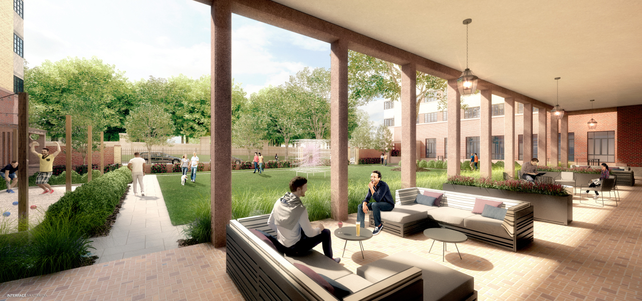 Cover Terrace overlooking lush courtyard at Âme Apartments with outdoor seating