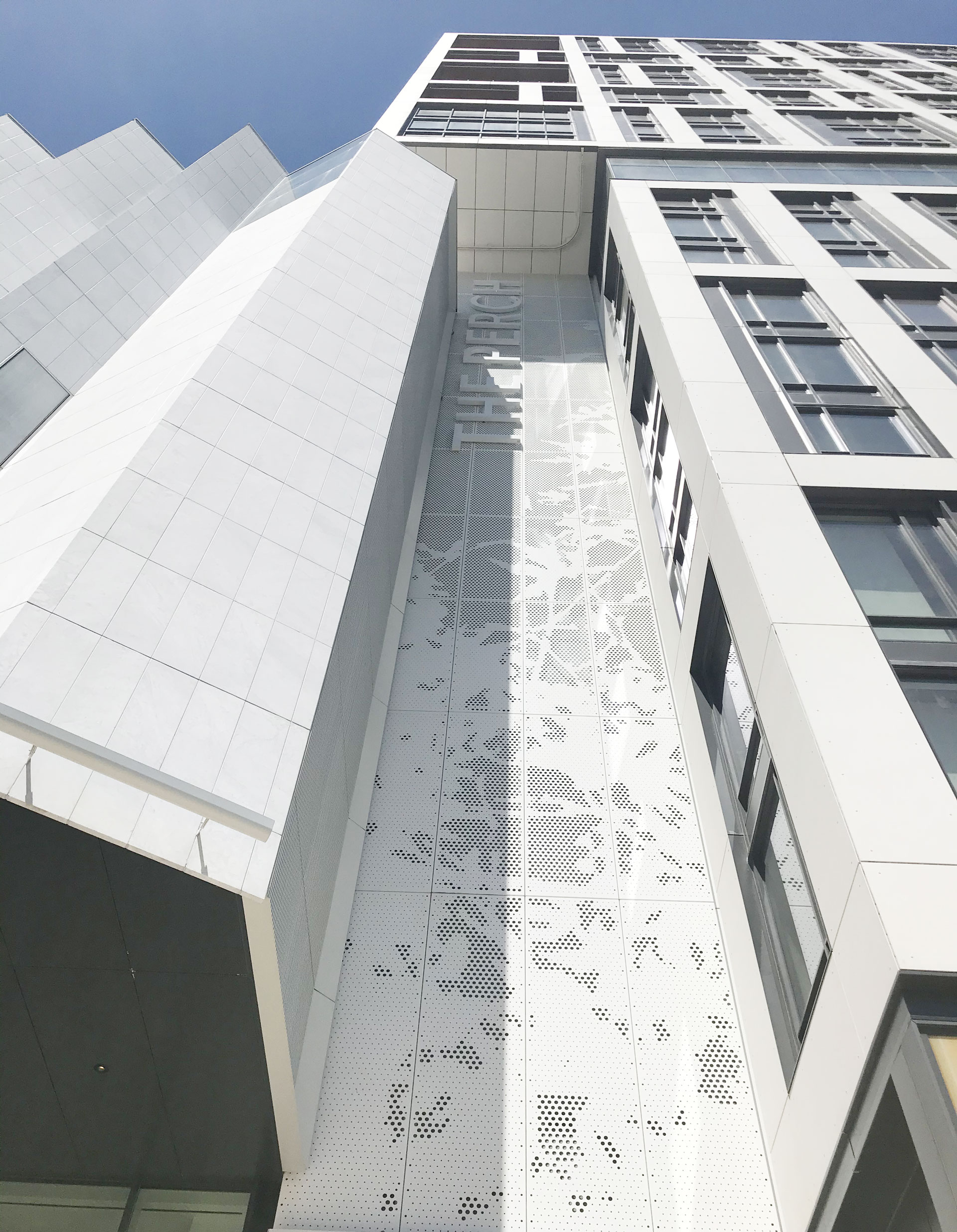 The Perch architectural signage and dimensional branding elements on building