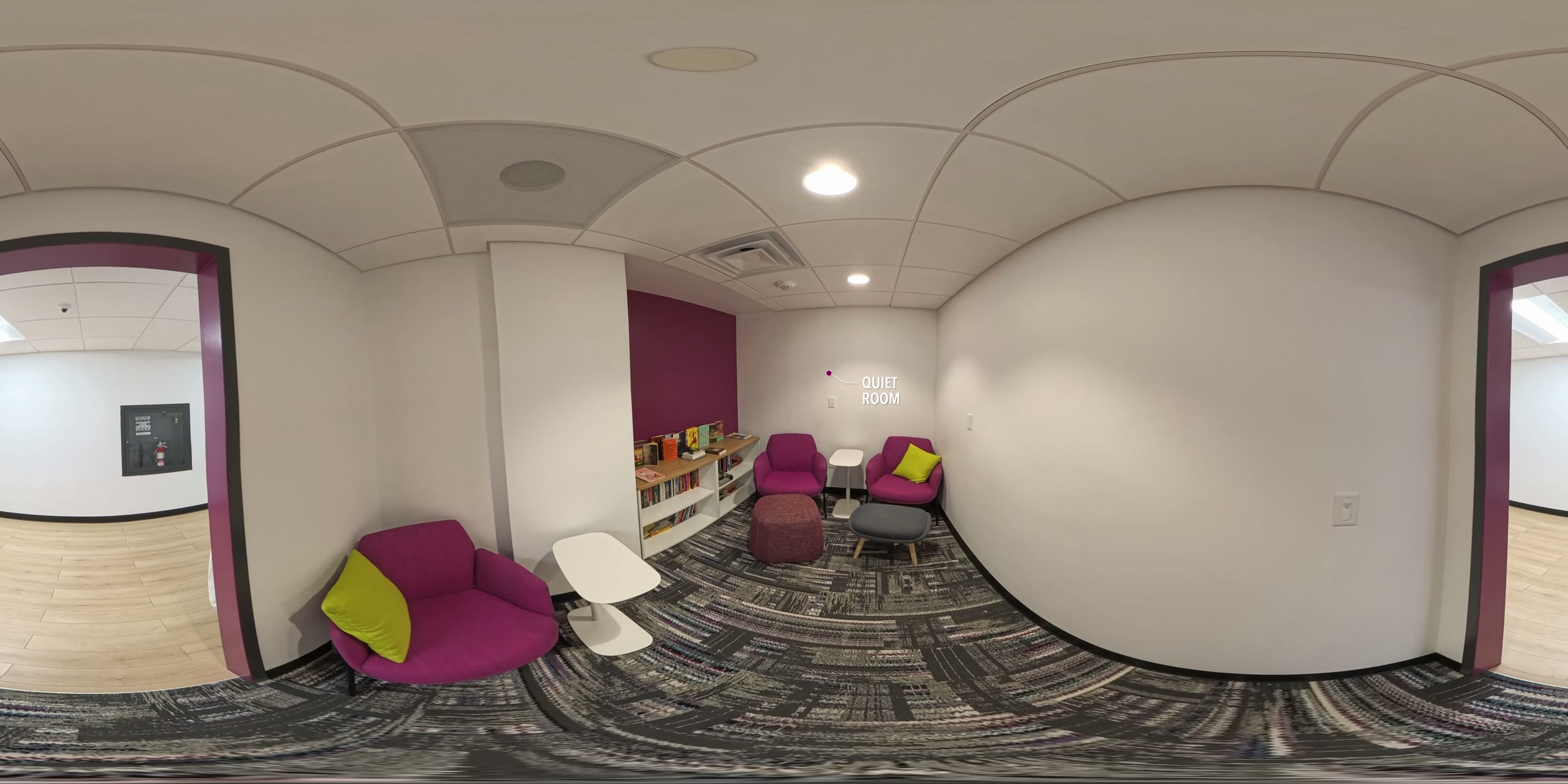360-degree view of the quiet room, a participant lounge space with seating and a small bookshelf.