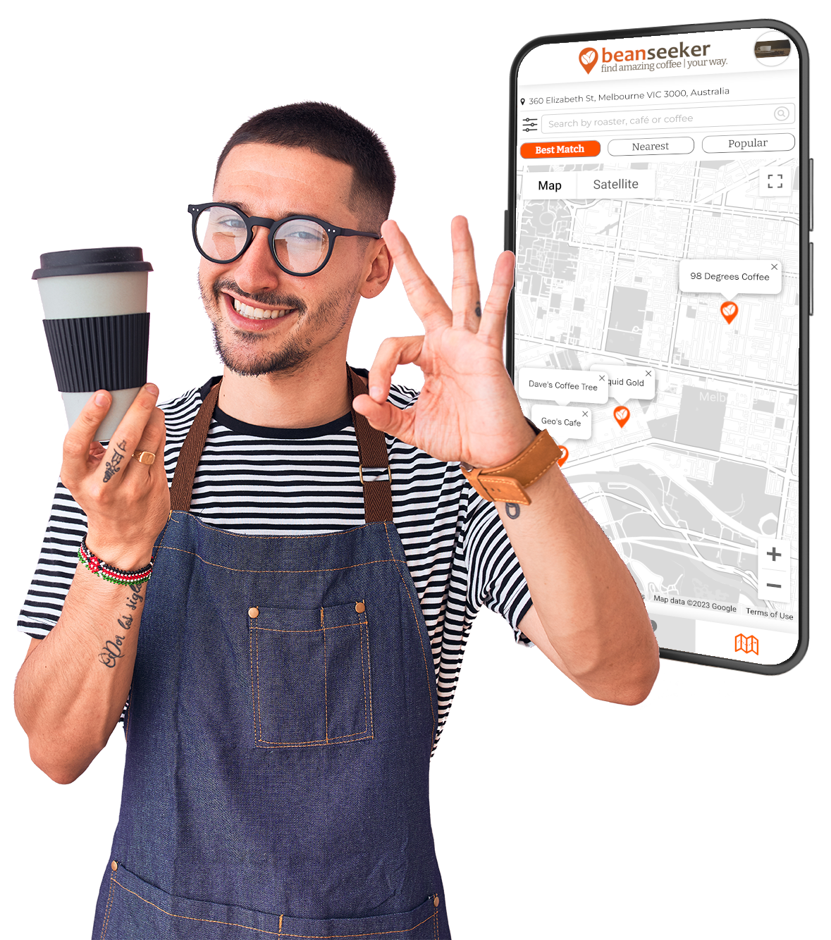 A barista holding coffee with one hand, while making the hand signal for A-OK with his other hand.