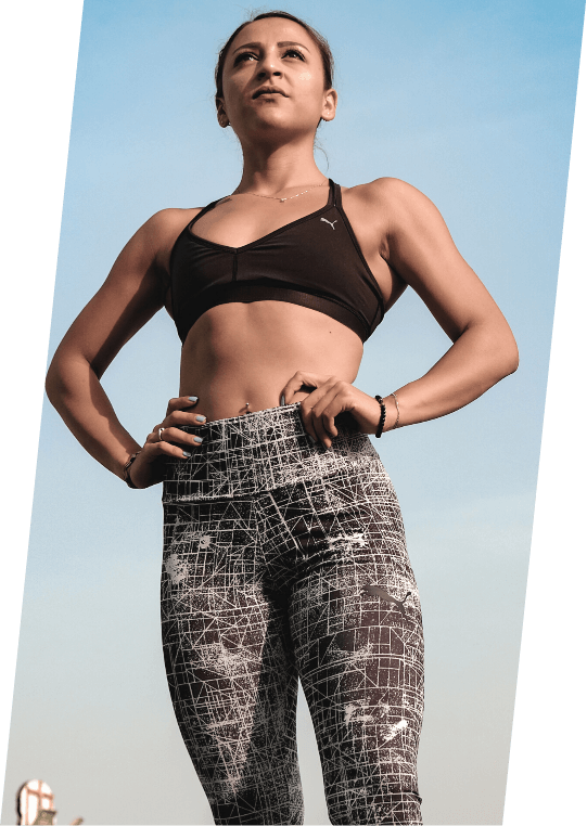 Female mesomorph posing and standing strong