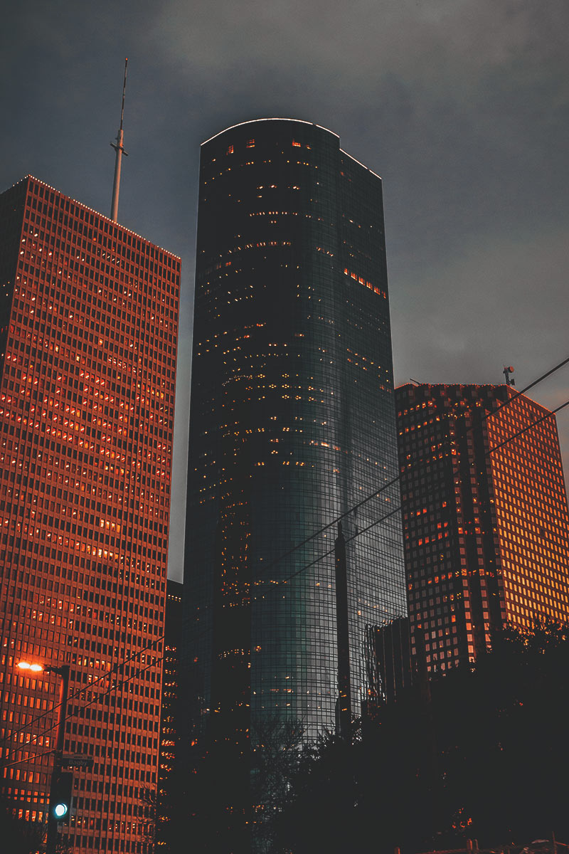 Downtown cityscape of tall office buildings at dusk