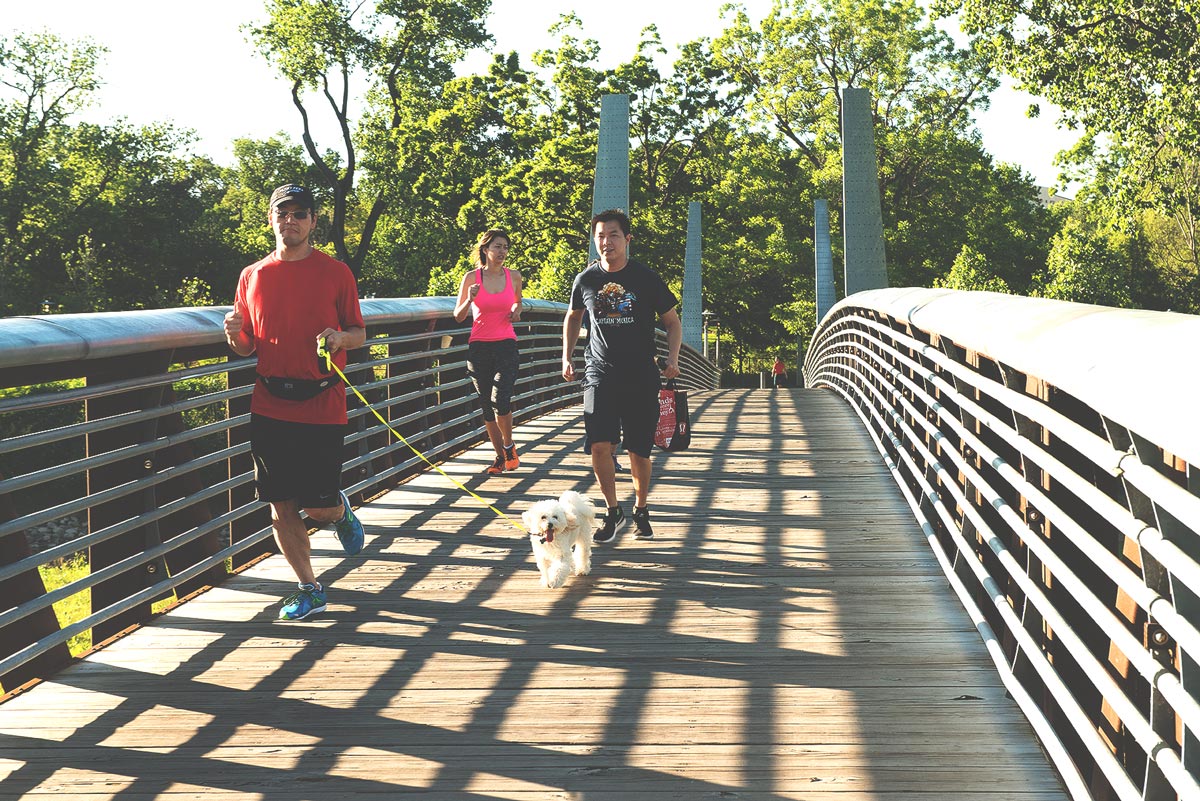 Houston Culture - residents are jogging over a bridge