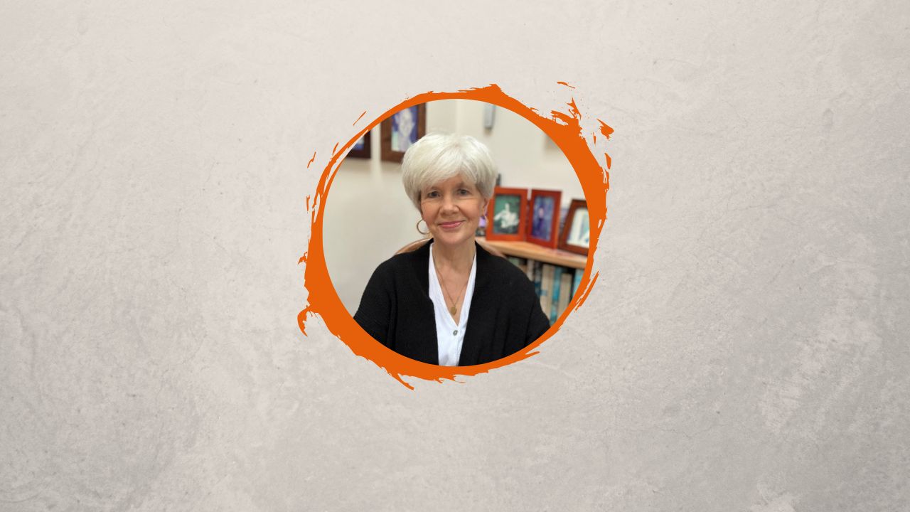 Headshot of author Mary Lawson on an orange circular background.