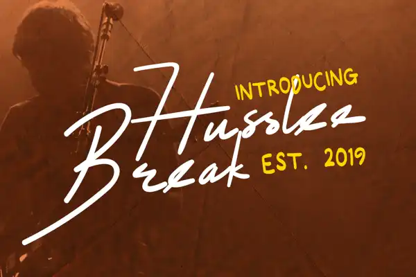 Husslee Break energetic handwritten font with smooth dynamic lines