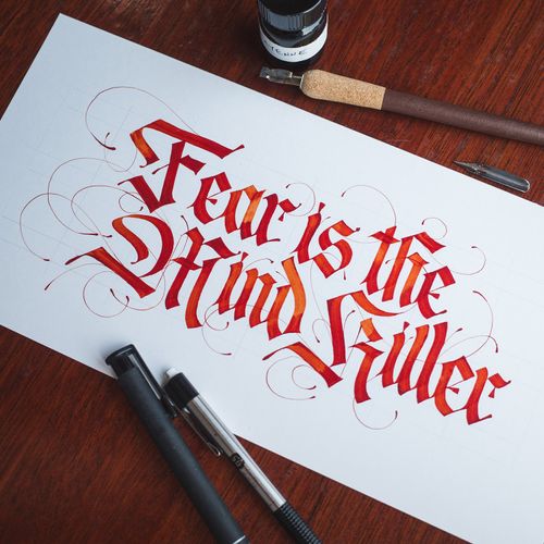 "Fear is the Mind-Killer," quoted from Frank Herbert's 'Dune', written in modern Fraktur calligraphy.