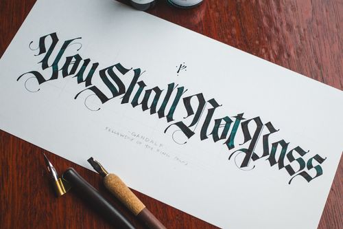 "You shall not pass," a Gandalf quote from The Lord of the Rings films, written in modern Fraktur calligraphy.