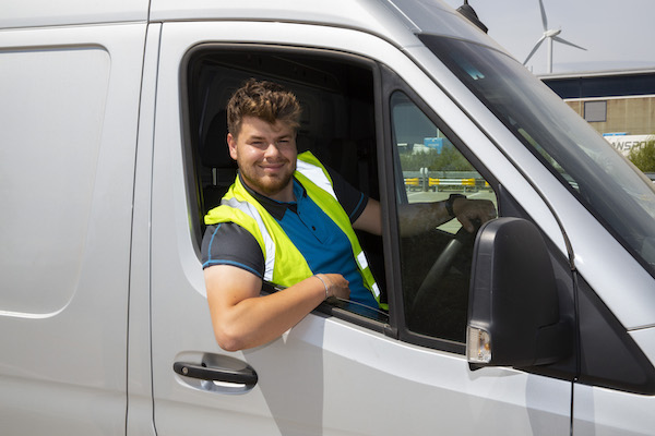 A same day delivery driver sat in a van