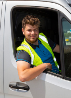 A same day delivery driver sat in a van
