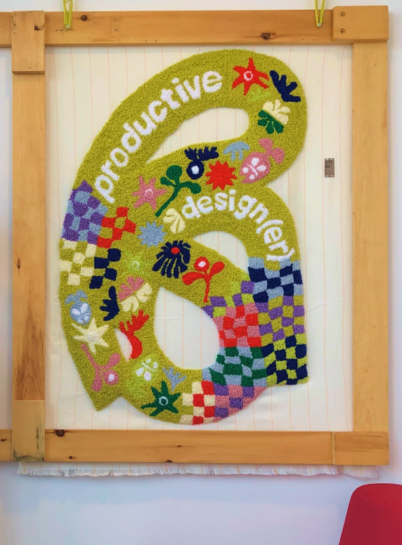 An image of a 3' by 4' rug with the text "Product(ive) Designer"