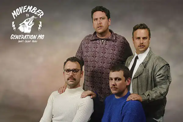 Image of Quiz Meisters employees sporting moustaches with Movember logo