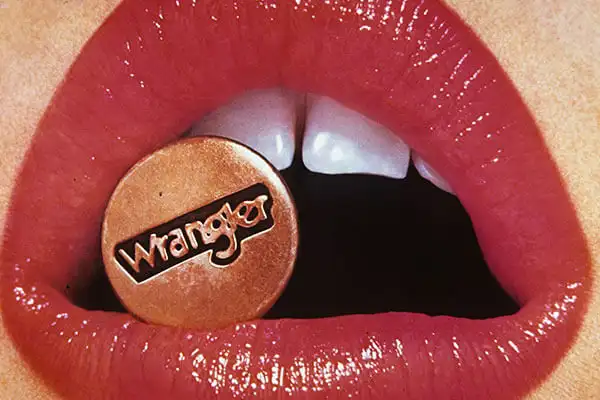 Promotional Wrangler image of a button in a mouth