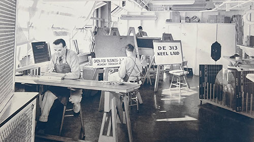 Artists inside Shop 71 hard at work hand painting signage in 1944.