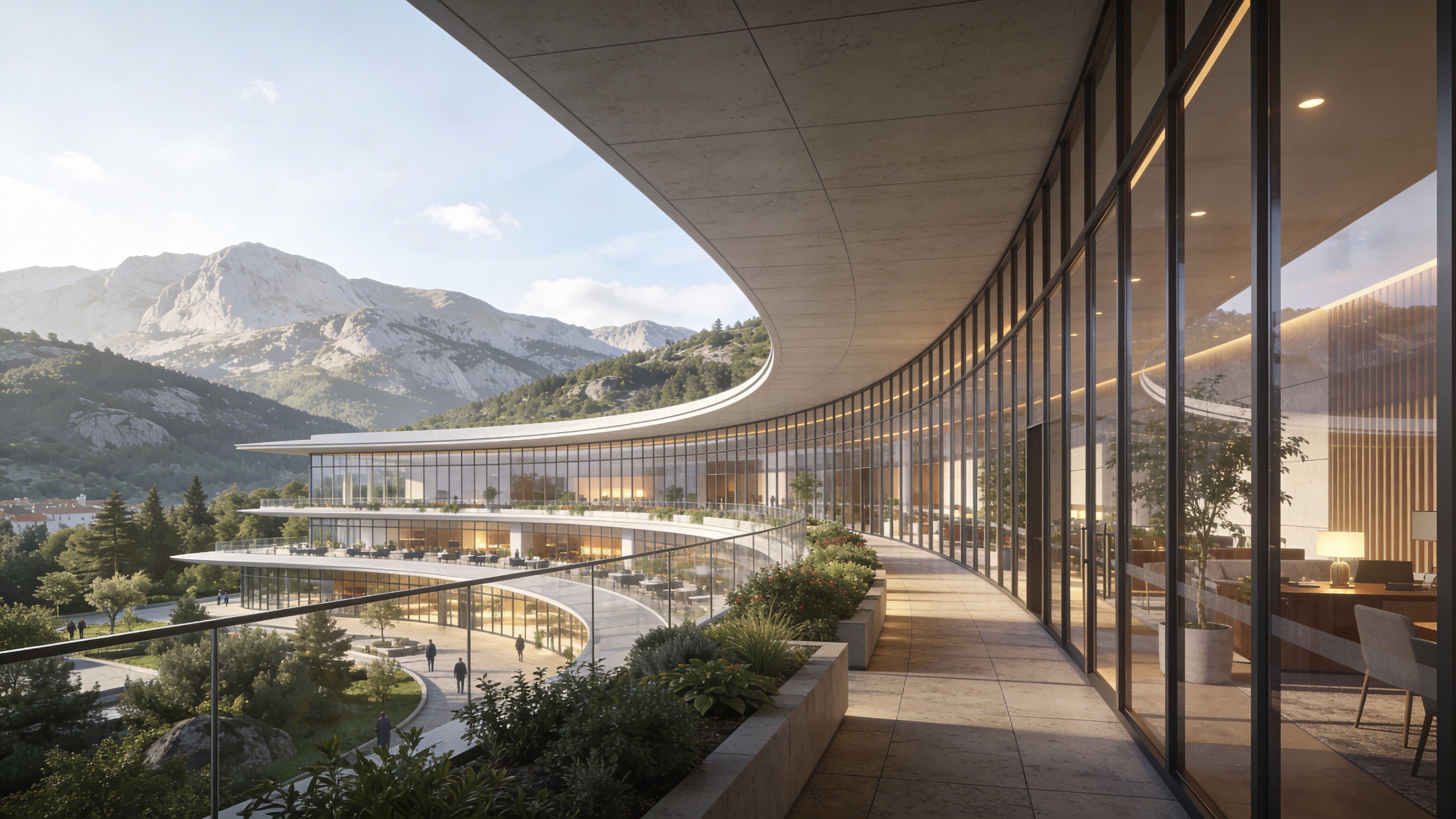 Vista panorámica de una oficina moderna con balcones curvos rodeada por montañas en el horizonte soleado