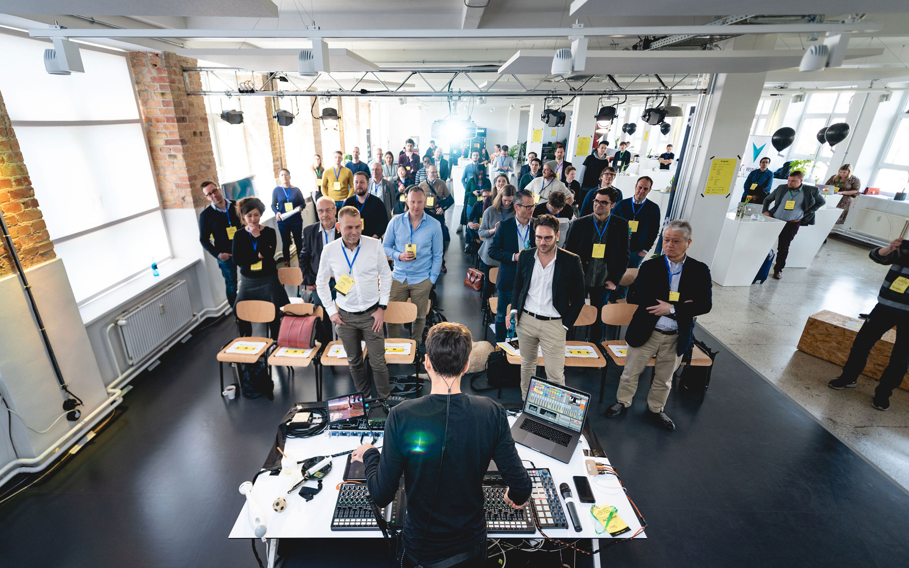 people sitting near the windows and listening to a concert at sofar sounds event in betahaus kreuzberg coworking space