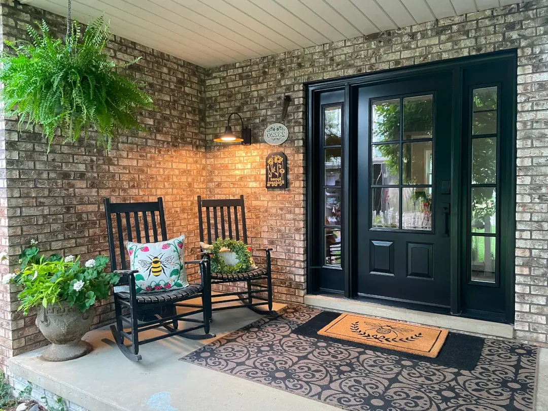 black front door replacement in enclosed entrance