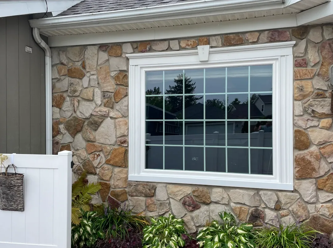 full window outside stone siding