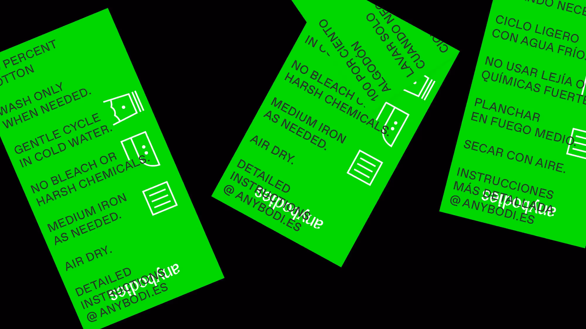 A picture of three neon green wash instruction tags.