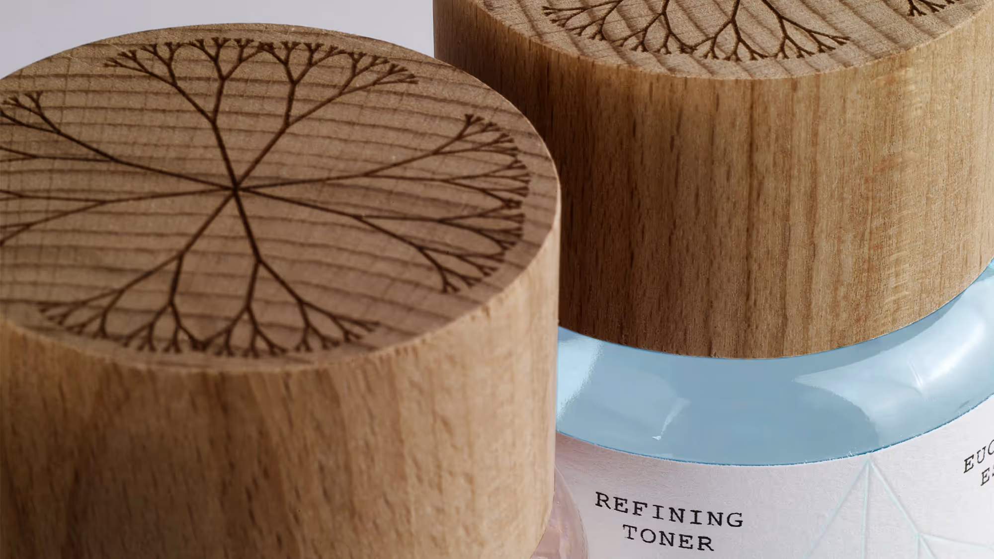 Close up of the packaging's wooden laser-etched cap.