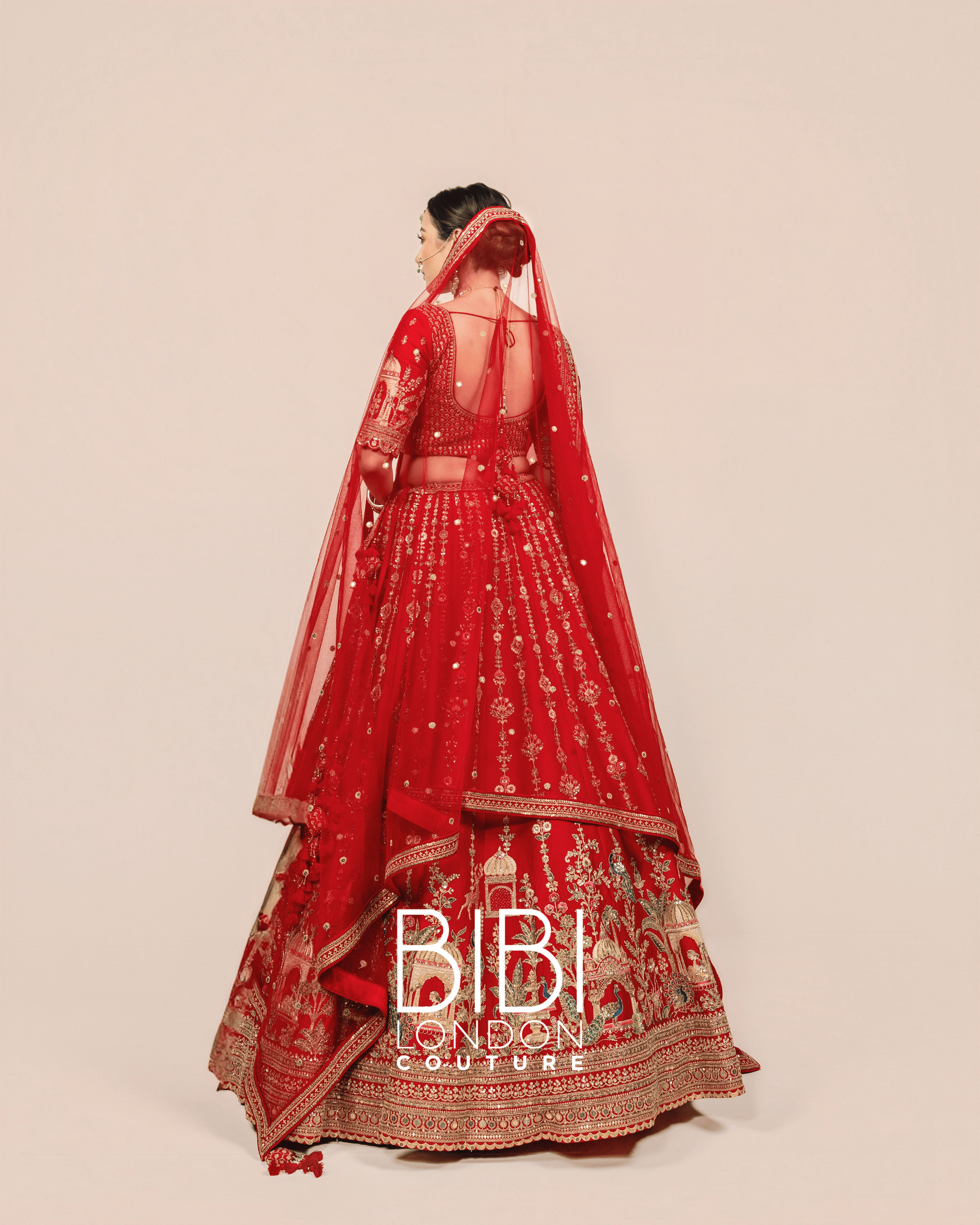 Red Lehenga with Palace Motifs and Animal Detailing 