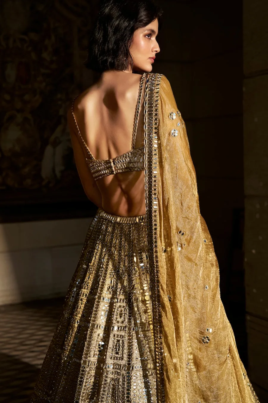 Antique Gold Lehenga with Mirrorwork Geometry and Embellished Blouse