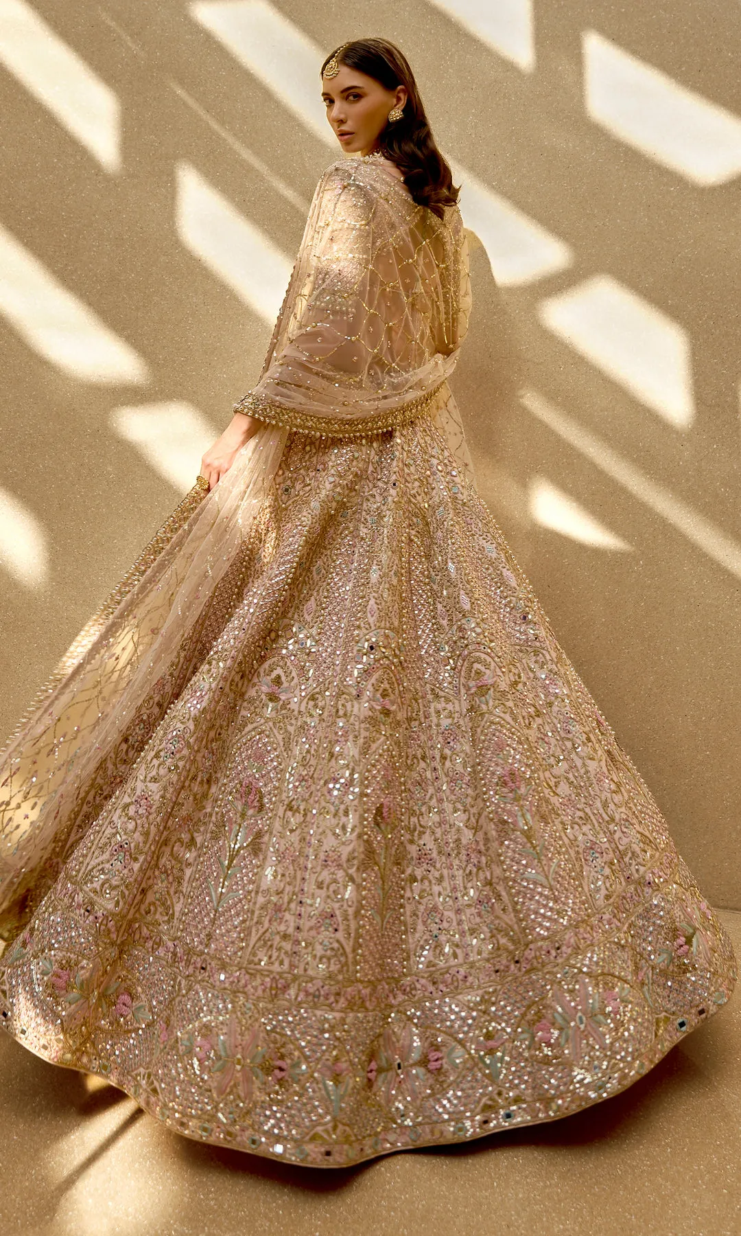 Champagne Blush Lehenga with Intricate Mirrorwork and Pastel Floral Embroidery