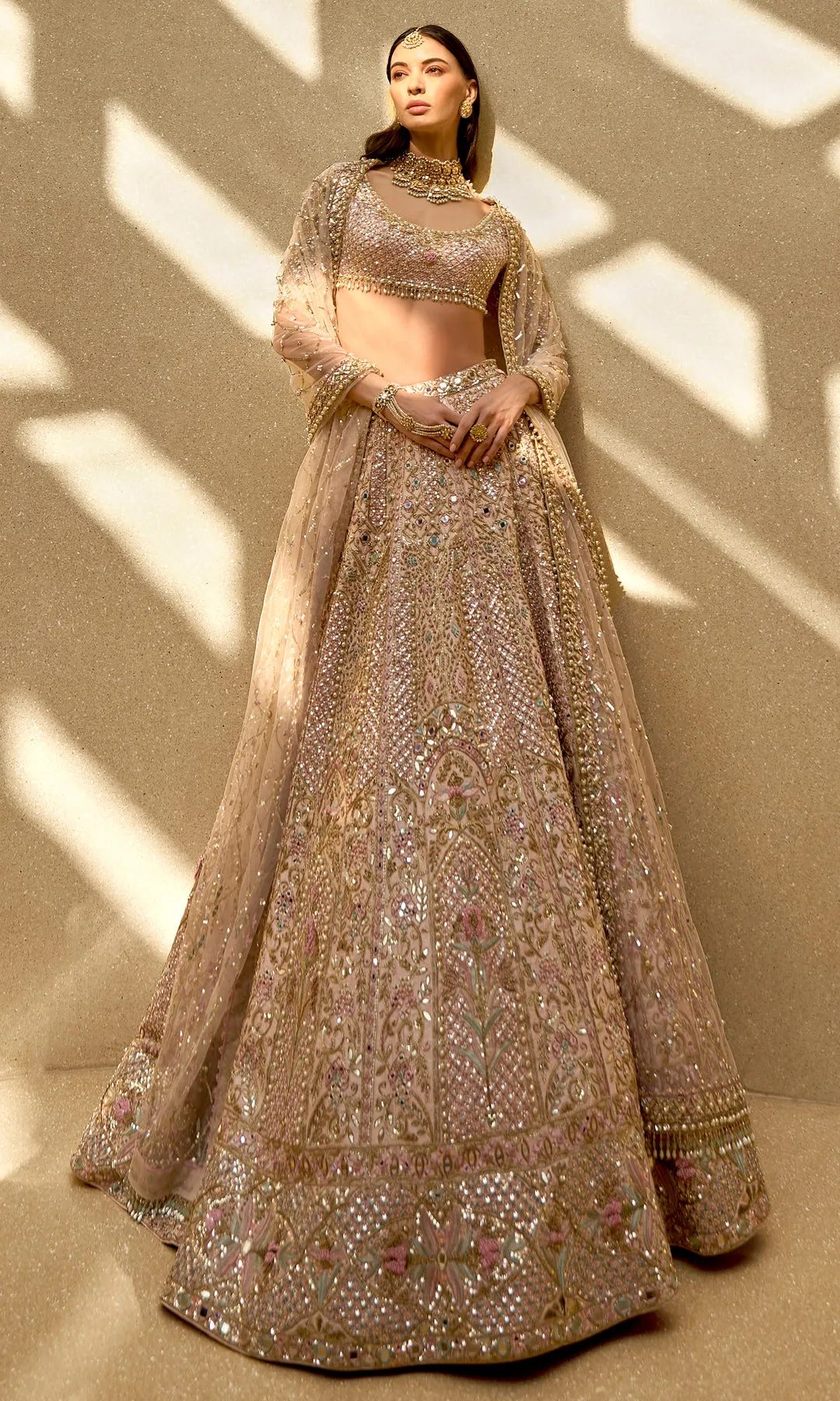 Champagne Blush Lehenga with Intricate Mirrorwork and Pastel Floral Embroidery