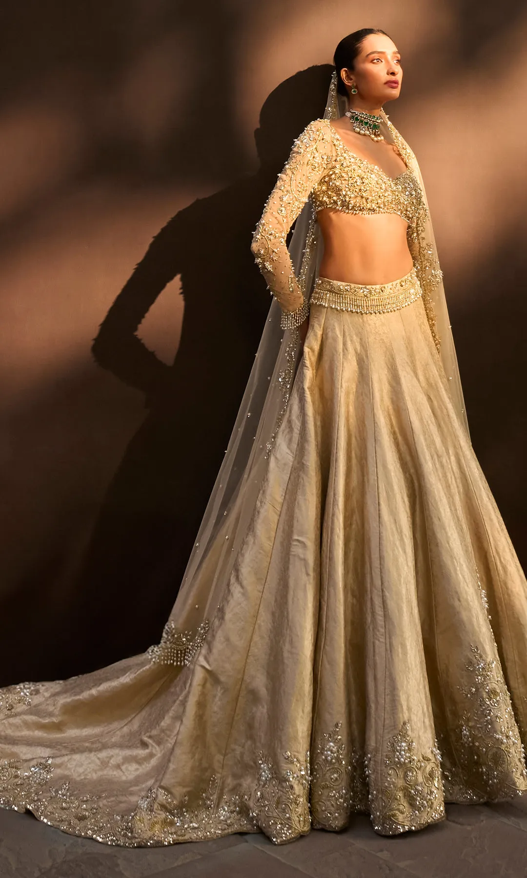 Antique Gold Lehenga with Crystal Hand Embellished Blouse and Soft Net Dupatta