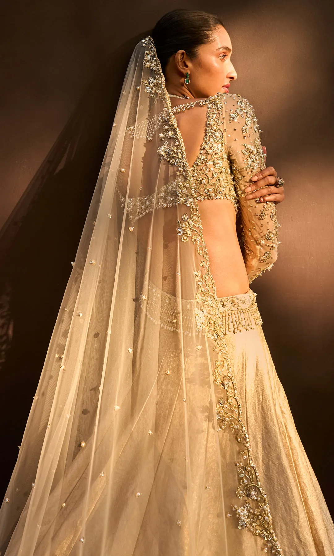 Antique Gold Lehenga with Crystal Hand Embellished Blouse and Soft Net Dupatta