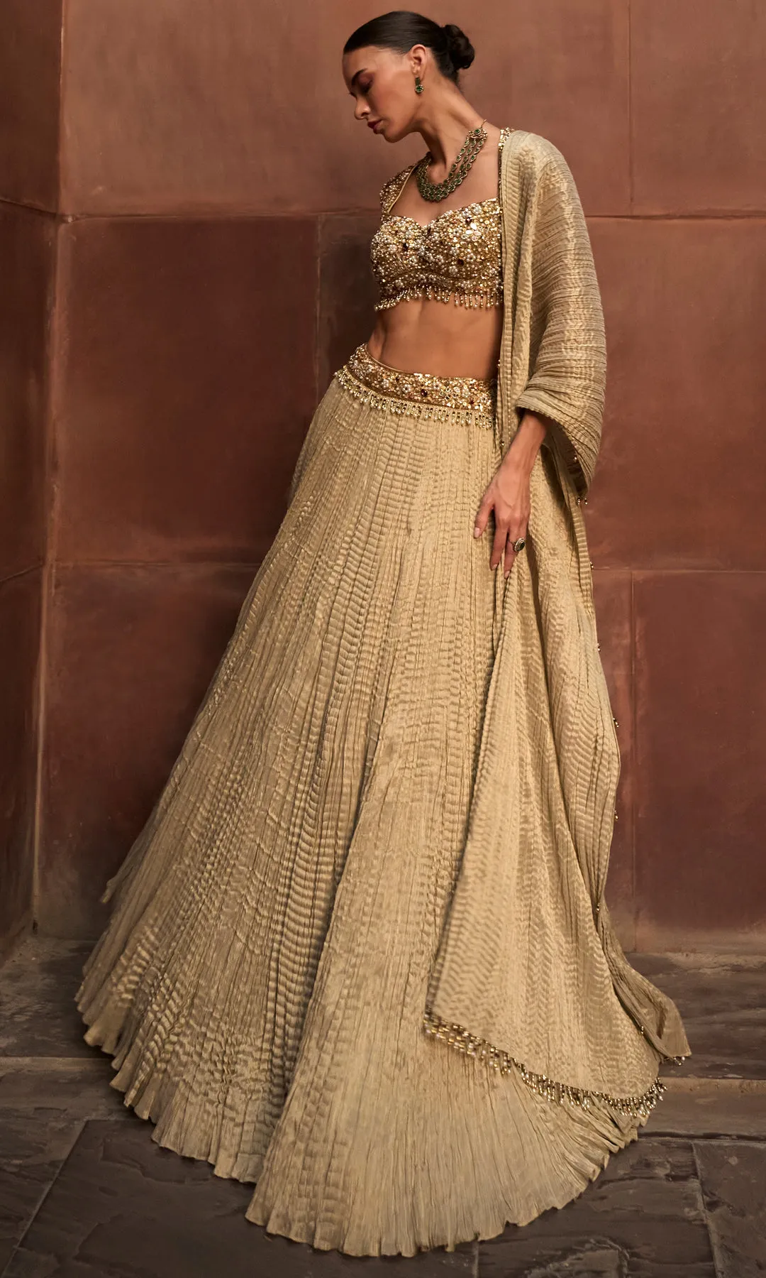 Antique Gold Pleated Lehenga with Heavily Embellished Blouse and Draped Dupatta