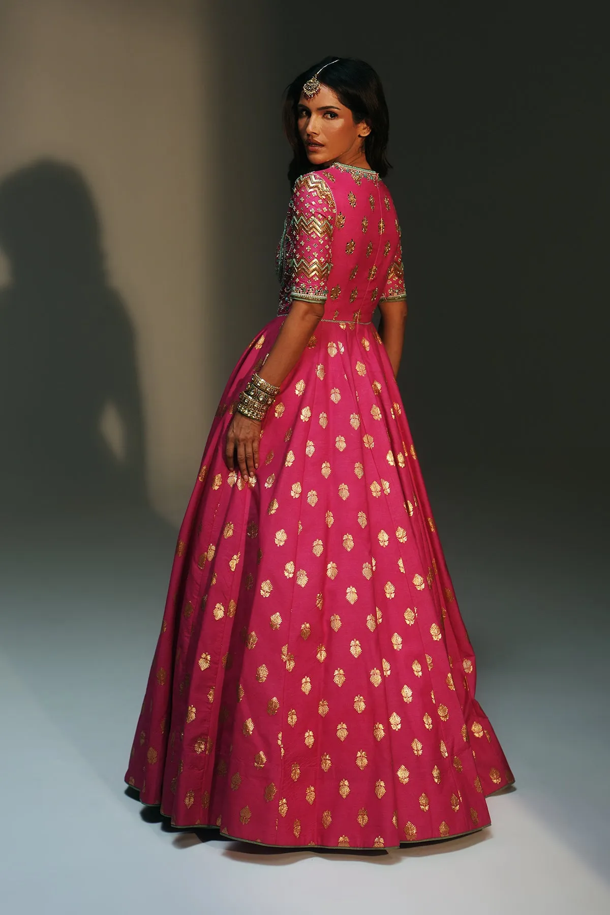 Fuchsia Pink Lehenga with Gold Buti Motifs and Embroidered Blouse