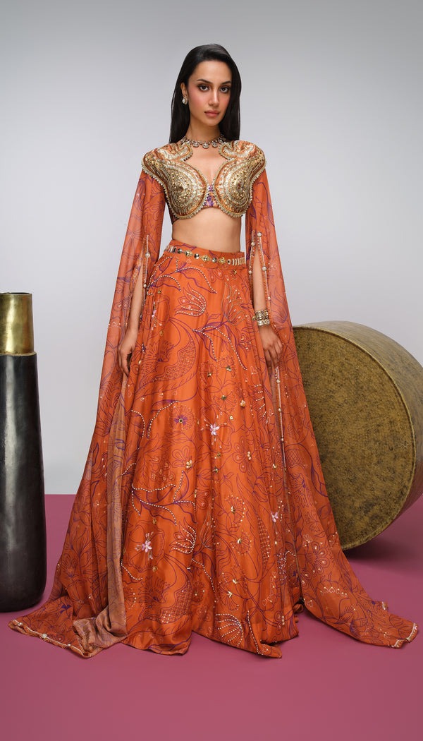  Burnt Orange Lehenga with Floral Embroidery and Gold Sculpted Blouse
