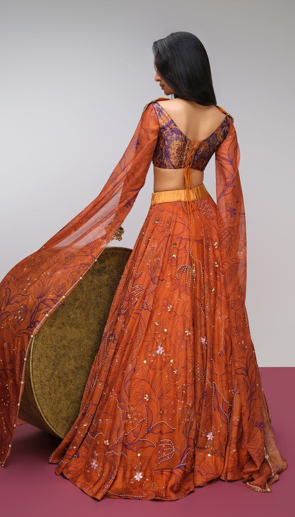  Burnt Orange Lehenga with Floral Embroidery and Gold Sculpted Blouse