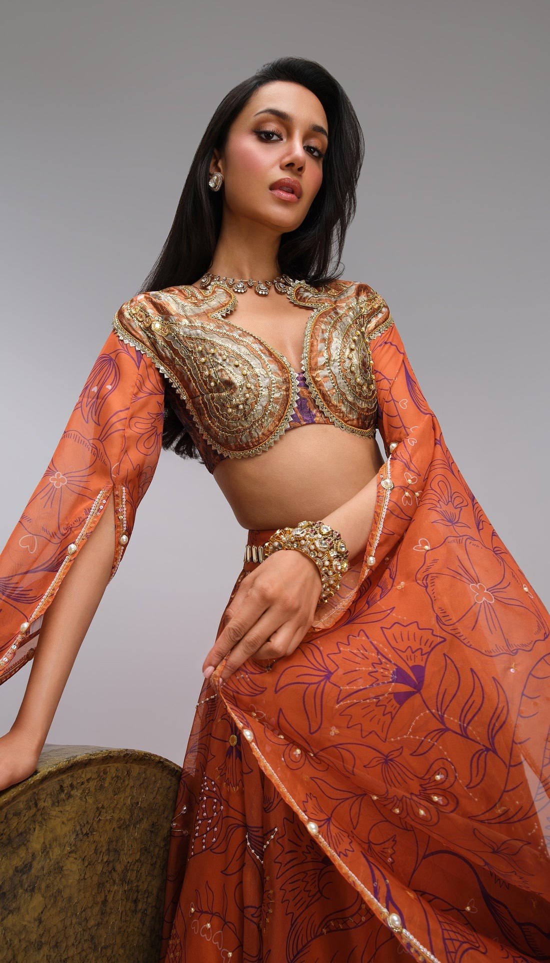  Burnt Orange Lehenga with Floral Embroidery and Gold Sculpted Blouse