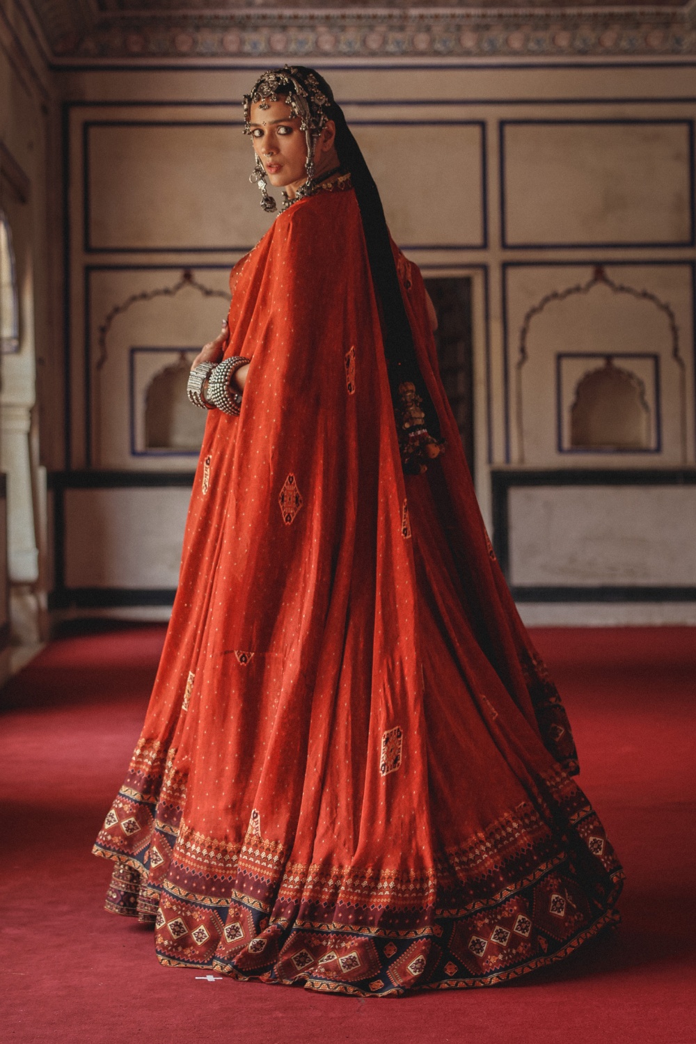Burnt Coral Lehenga with Antique Mirrorwork and Draped Cape Dupatta
