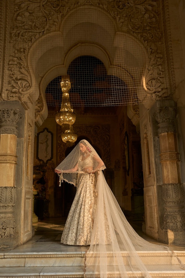 Ivory Bridal Lehenga with Silver Floral Embroidery and Pearl Tassel Blouse