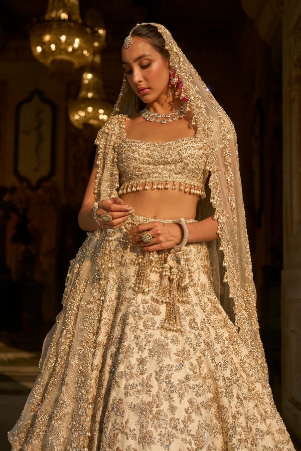Ivory Bridal Lehenga with Silver Floral Embroidery and Pearl Tassel Blouse