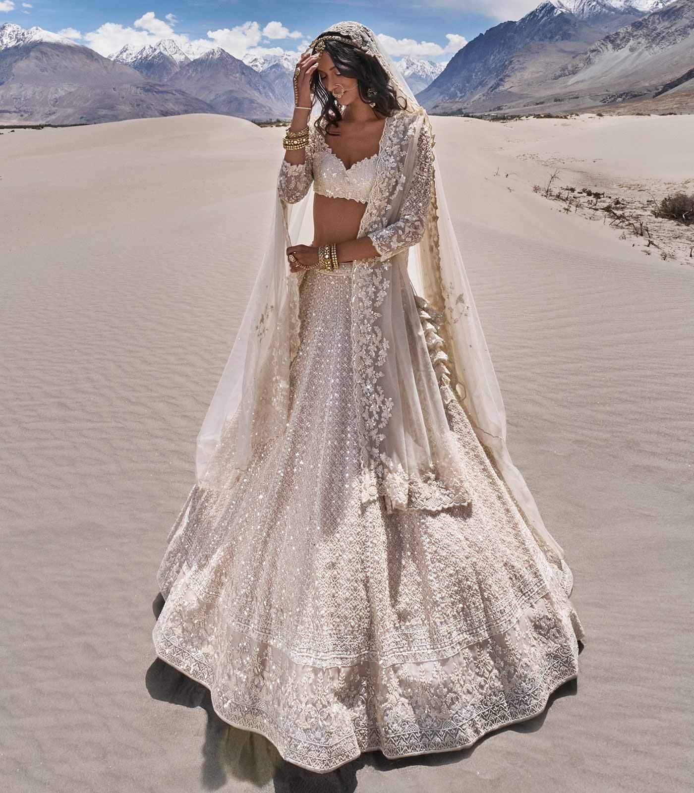 Ivory Bridal Lehenga with Intricate Silver Embroidery and Statement Dupatta