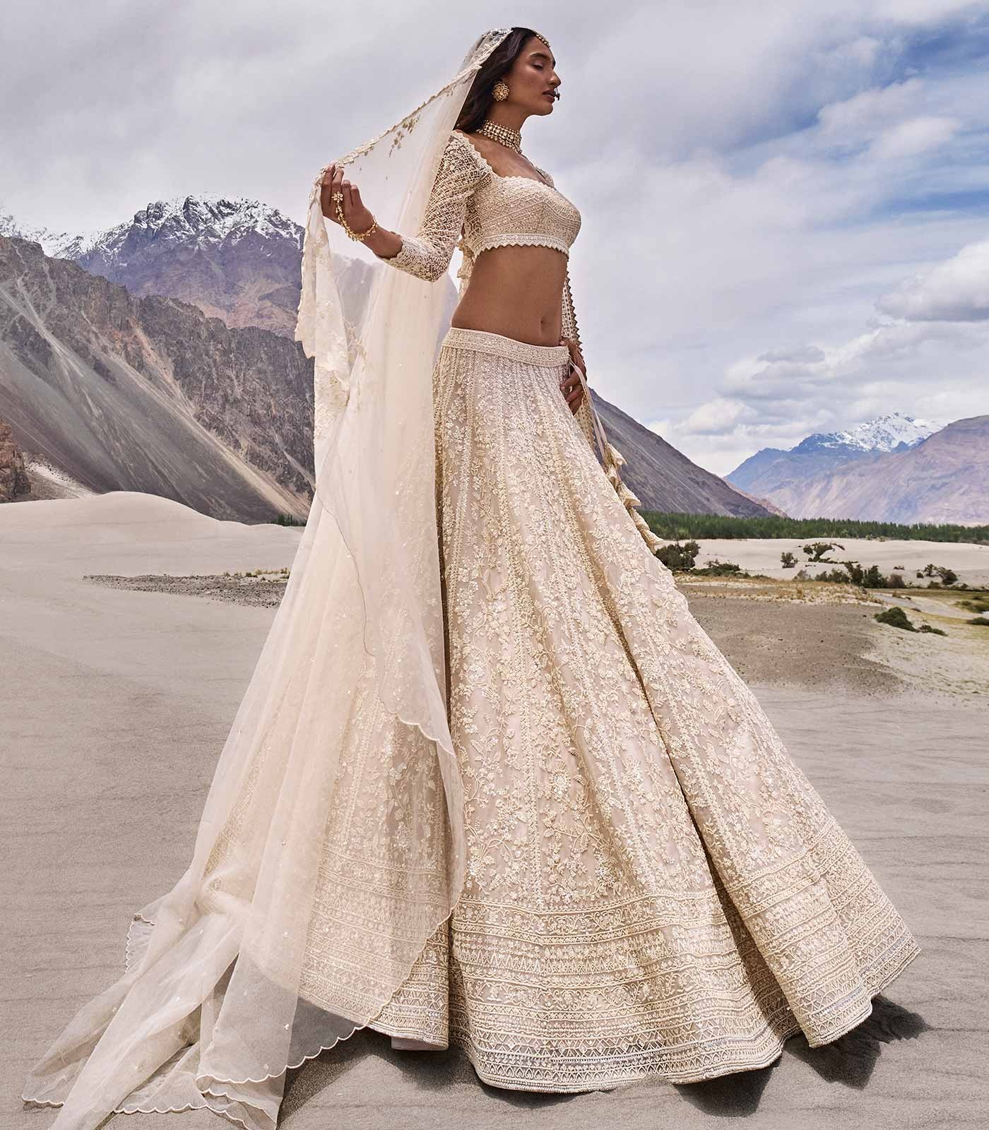 Ivory Bridal Lehenga with Intricate Threadwork and Heritage Embroidery