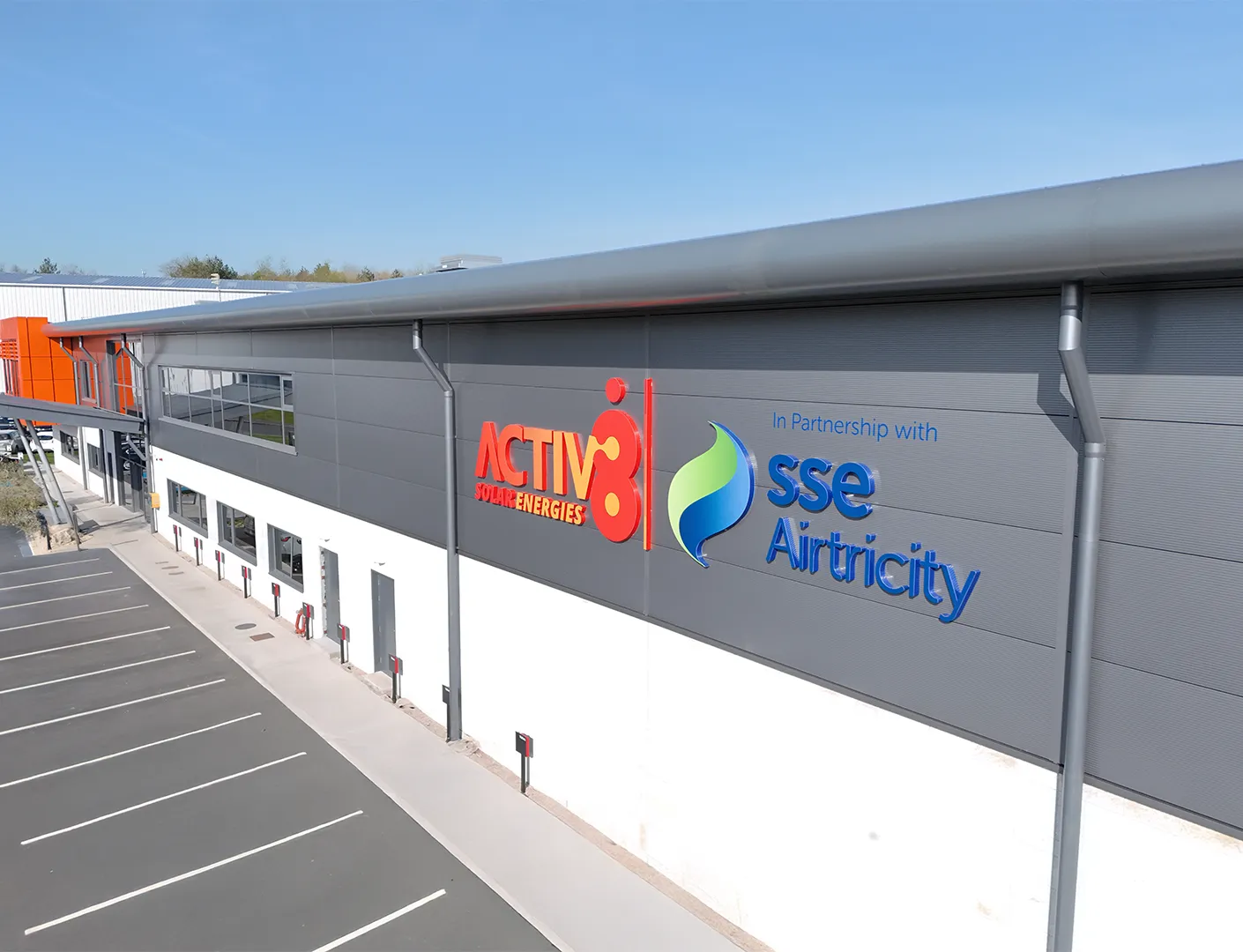 Exterior view of Activ8 Solar Energies headquarters featuring branding and SSE Airtricity partnership signage