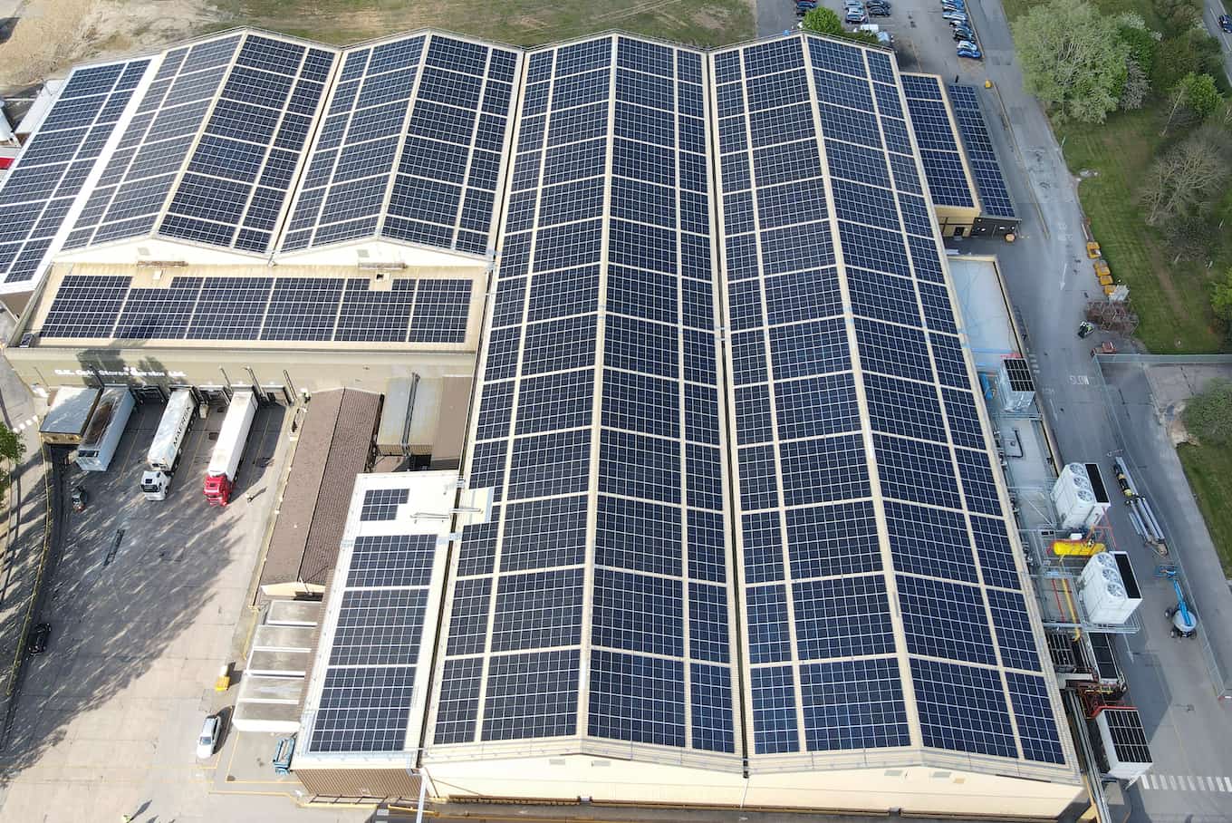 Drone shot of QK Marston facility covered with solar panels on the roof
