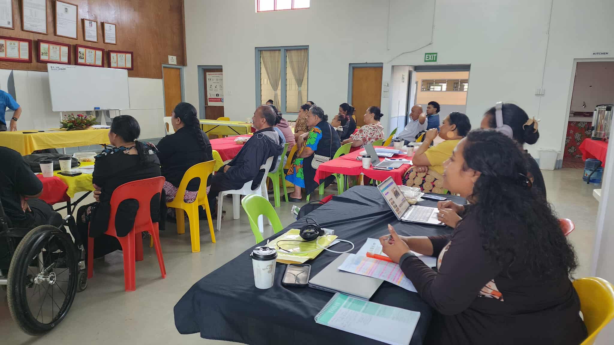 Workshop in progress with group discussions around the tables