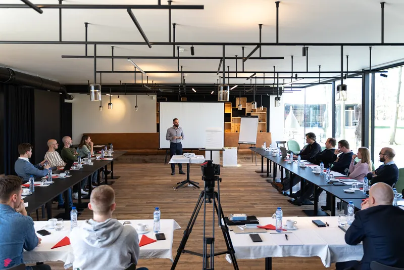 Man shaking hand in team meeting
