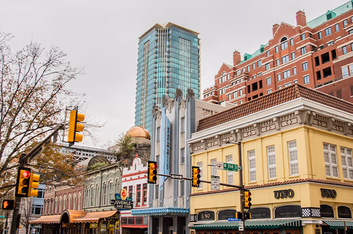 A street view photograph of a city skyline.
