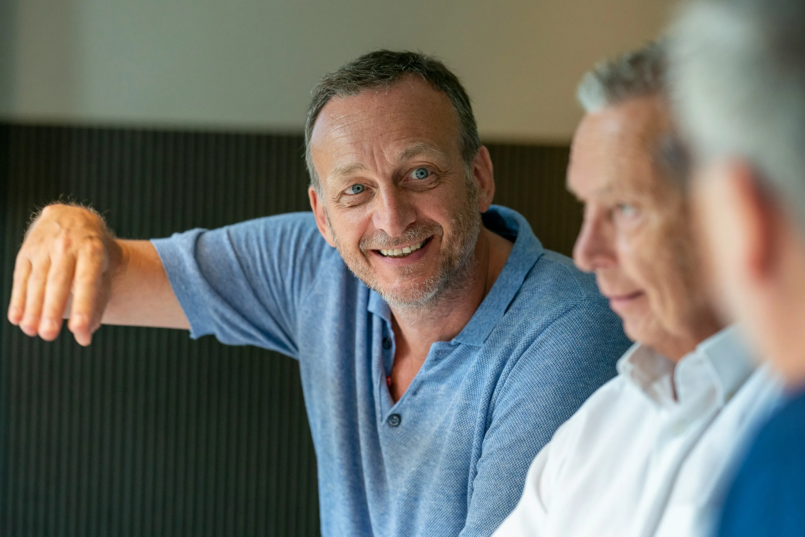 Smiling older Texas patients talking during a medical cannabis consultation