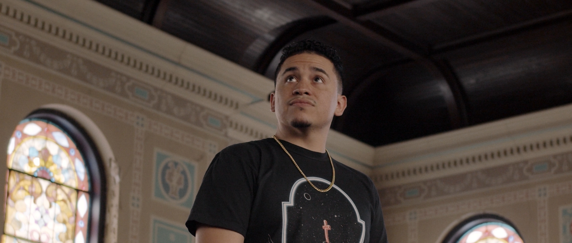 A still frame of A-Ram in church for "glorious" Music Video